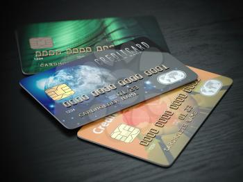Three colored credit cards isolated on black wooden desk background, 3d illustration