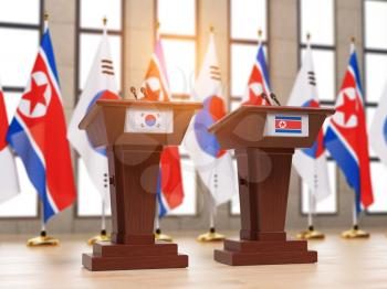 North Korea and South Korea deal c ooperation partnership and relationship. Flags of the North Korea and South Korea and tribunes at international meeting or press conference. 3d illustration