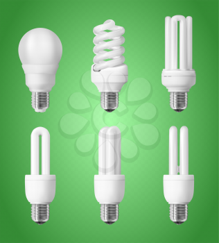 Set of energy saving light bulbs on green background