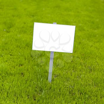 Sign on grass whith isolated space for caption