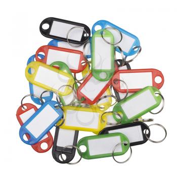 Plastic key tags of various colors isolated on white.
