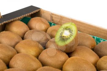 Green and yellow kiwi slices in kiwi fruit box