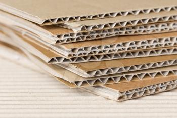 Cardboard pile on corrugated cardboard texture