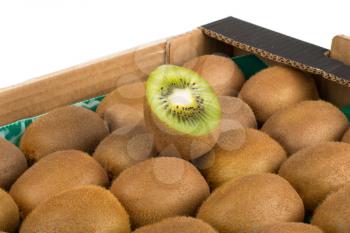 Green and yellow kiwi slices in kiwi fruit box