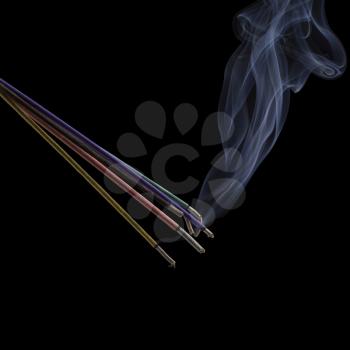 Burning incense sticks with smoke isolated on black