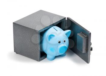 Blue ceramic piggy bank in a safe, isolated on white background. Bank savings, economy, financials investments, saving to buy a house, a car, for retirement concept.