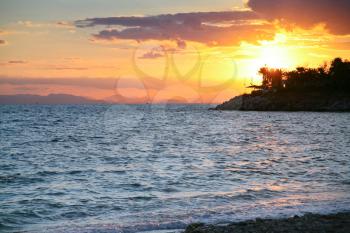 sunset on Saronic Gulf of Aegean Sea near Athens, Greece