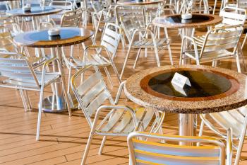 no smoking table in outdoor cafe on stern of cruise liner