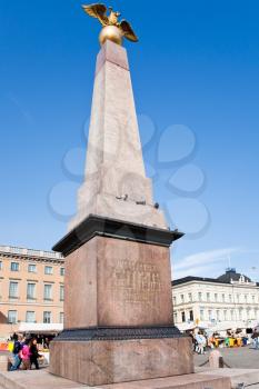 stone obelisk of Empress Alexandra on Market square in Helsinki, Finland