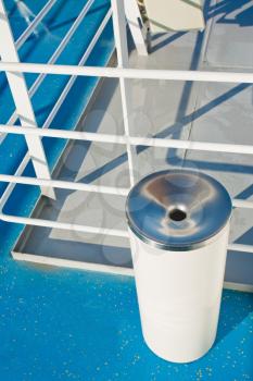 white spittoon on deck of cruise liner