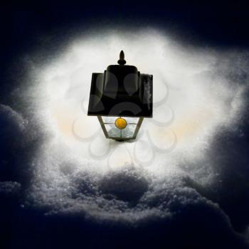electric lamp in snowdrift top view at night