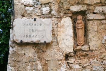 Old medieval wall of stone building on Passage Des Sarrazins in ancient town in Eze, France