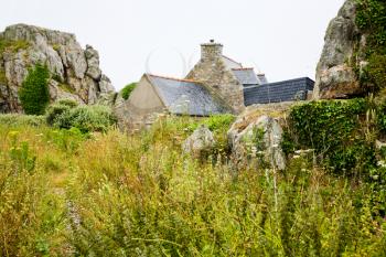 country Breton house between boulder, in Brittany, France