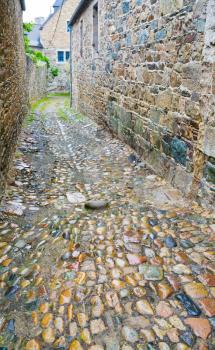 old stone side street in Breton town Treguier, France