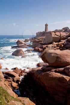 lighthouse in the rocks on Pink Granite Coast in France