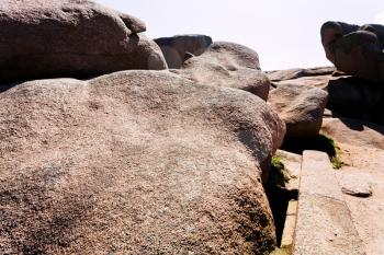 large Pink granite boulders on sea coast in Brittany, France