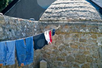 drying of linen under sun in summer day in Brittany village