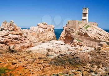 lighthouse in the rocks on Ile de Brehat in France