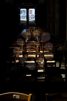 wood chairs under sunbeam in cathedral (La Cathedrale Saint-Tugdual,Treguier, France)
