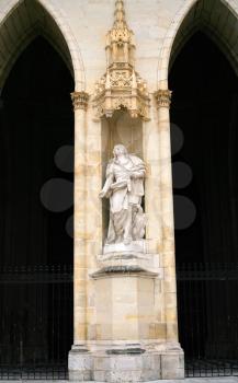 statue in wall of Orleans Cathedral, France