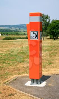 Bright orange light reflecting traffic box SOS in France