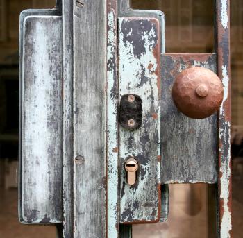 old lock at metal and glass door