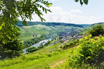 above view of town Zell in Moselle valley and Mosel river in summer day, Germany