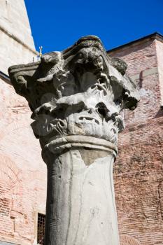 ancient Corinthian column from antique Byzantine temple in yard of Aya Sofia basilica