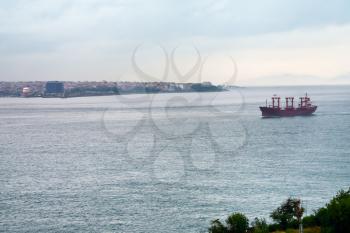 ship in Bosporus gulf and Istanbul view in overcast day