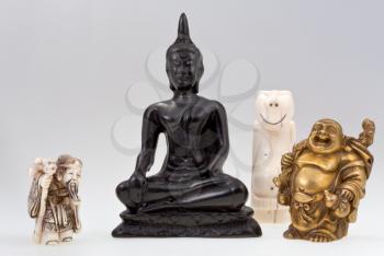small gods - statuettes of gods and idol with gray background