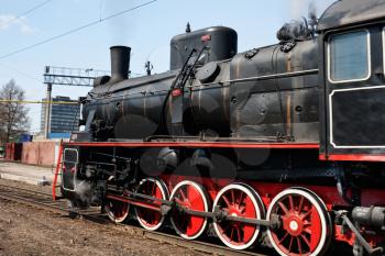black steam locomotive on railway