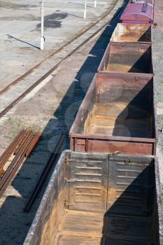 empty open freight cars on railroad
