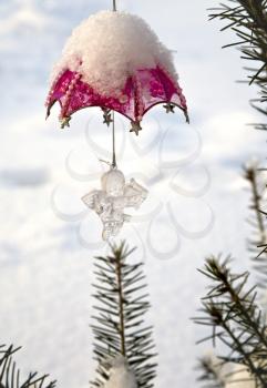 Christmas-tree decoration (clear angel) on the tree outdoor