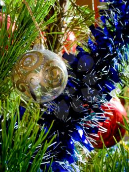 blue tinsel and glass balls on Christmas-tree