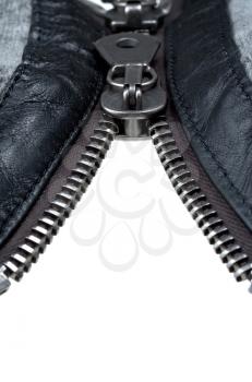 metal double zipper lock in unzip jacket. close-up