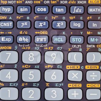 keypad of scientific calculator with many mathematical functions close up