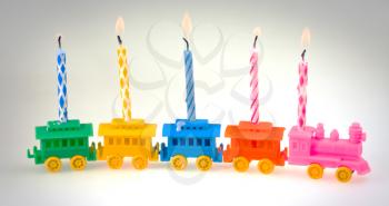 toy train with celebrate burning candles