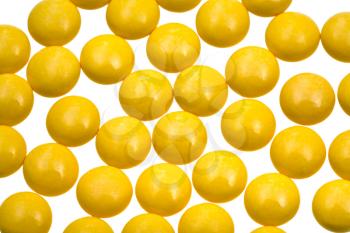 many yellow vitamin drug close up
