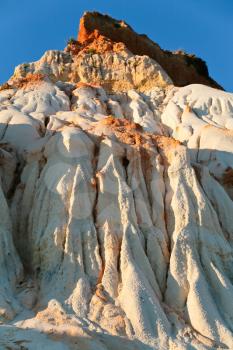 mountain from white and orange sand, Algarve, Portugal