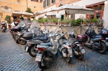 lunch time - scooters around restaurant in Rome on December 16, 2010
