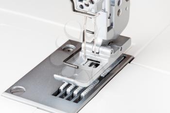 needles and foot of sewing machine