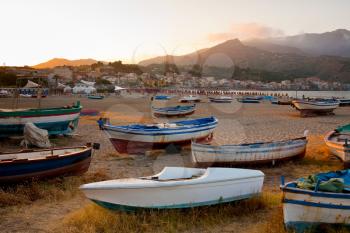 boats on beach at sunset, Sicily, Italy