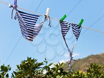 drying female swimsuit outdoor on mountain hill in summer day