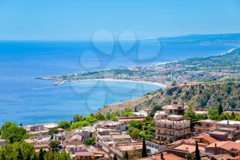 view on town Taormina and resort Gardini Naxos on Ionian coast, Sicily