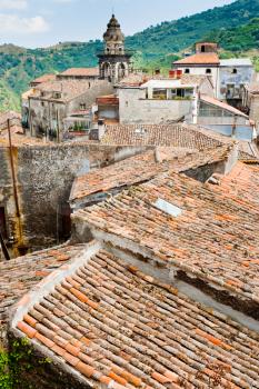 view on ancient tile roofs and tower of Sant Antonio church in Castiglione di Sicilia