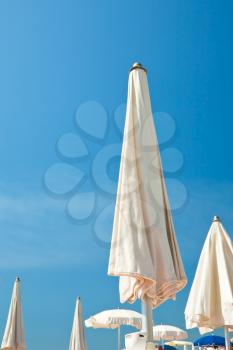 parasols and blue sky on Marina Di Cotone blue flag beach in Sicily