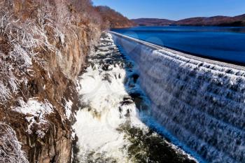 river waterfall on Croton Dam in winter day