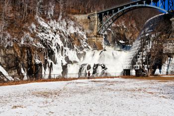 panoramic view of waterfall cascade on river dam in winter