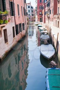 parking of private boats on canal in Venice, Italy