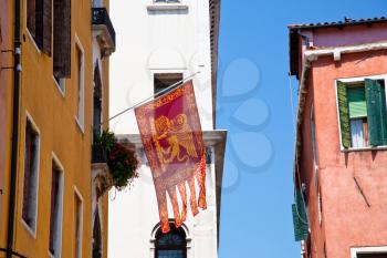 Flag of the Most Serene Republic of Venice on urban house in Venice, Italy